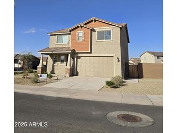 Charming two-story home with a two-car garage and neutral color scheme at 10968 W Baden St, Avondale, AZ 85323