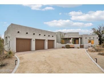 Beautiful desert home featuring a three-car garage and Southwestern architectural details at 30600 N Pima Rd # 24, Scottsdale, AZ 85266