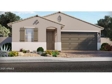 Charming single-story home with neutral stucco, shuttered windows, and inviting desert landscaping at 17636 W Adams St, Goodyear, AZ 85338