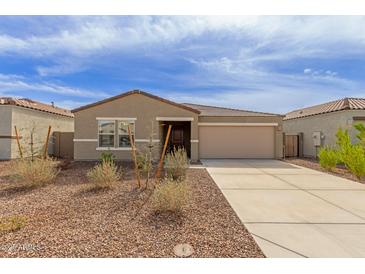 Charming single-story home with a neutral color scheme and a well-maintained front yard at 18449 E Eloisa Dr, Gold Canyon, AZ 85118