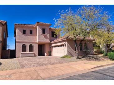 Two-story home with a well-maintained front yard and neutral color palette at 35210 N 34Th Ln, Phoenix, AZ 85086