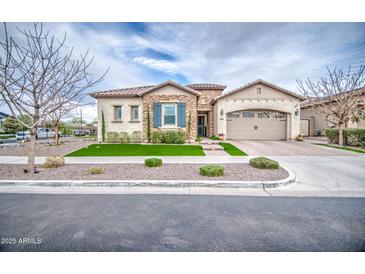 Charming single-story home with stone accents, manicured lawn, and inviting curb appeal at 4207 S Electron --, Mesa, AZ 85212