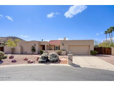 Charming single-story home with a desert landscape and a well-maintained front yard at 536 W Surrey Ave, Phoenix, AZ 85029