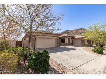 Charming single-Gathering home with a two-car garage, desert landscaping and beautiful curb appeal at 5721 W Molly Ln, Phoenix, AZ 85083
