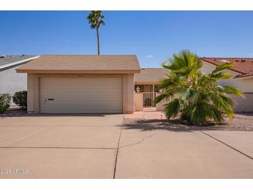 Charming single-story home featuring a two-car garage, low maintenance landscaping, and inviting curb appeal at 1632 Leisure World --, Mesa, AZ 85206