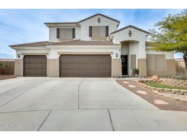 Stunning two-story home featuring a three-car garage and professionally landscaped front yard at 23693 W La Vista Cir, Buckeye, AZ 85396