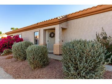 Charming home featuring manicured front yard landscaping and a welcoming entrance at 5826 E Nathan St, Mesa, AZ 85215