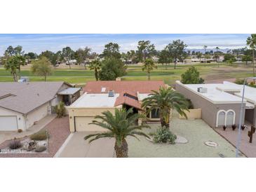 Charming single-Gathering home with a tile roof and low-maintenance desert landscaping in a golf course community at 9576 E Fairway Blvd, Sun Lakes, AZ 85248