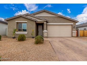 Charming single-story home with a two-car garage and low-maintenance landscaping at 13352 W Tether Trl, Peoria, AZ 85383