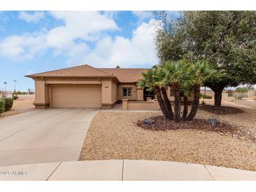 Charming single-story home featuring desert landscaping and a two-car garage at 20408 N Tanglewood Dr, Sun City West, AZ 85375