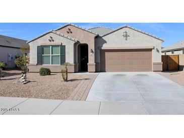 Charming single-story home with a two car garage and desert landscaping at 13612 W Desert Moon Way, Peoria, AZ 85383