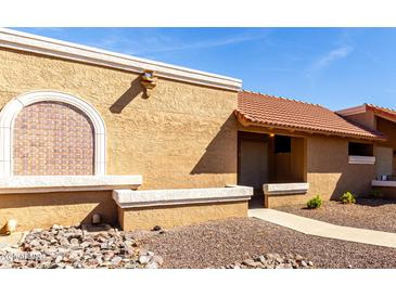 Charming single-story home features a red tile roof and decorative window detail at 20421 N 3Rd Dr # 2, Phoenix, AZ 85027