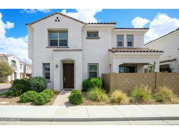 Charming two-story home featuring stucco siding, tile roof, and appealing desert landscaping at 741 N Abalone Ct, Gilbert, AZ 85233