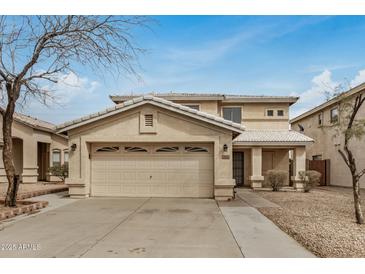 Charming two-story home with a well-maintained front yard and two car garage at 7413 N 67Th Dr, Glendale, AZ 85303