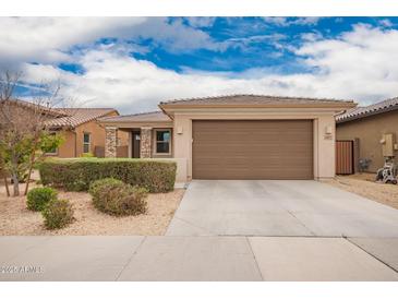 Charming single-story home featuring a two-car garage and well-maintained landscaping at 8957 W Palo Verde Dr, Glendale, AZ 85305