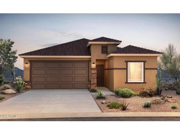 Charming single-story home with a two-car garage and desert landscaping at 25154 W Wier Ave, Buckeye, AZ 85326