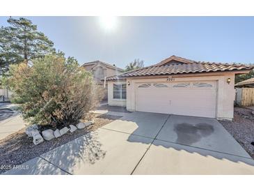 Charming single-Gathering home featuring a tile roof, a two-car garage, and desert landscaping at 3001 E Amber Ridge Way, Phoenix, AZ 85048