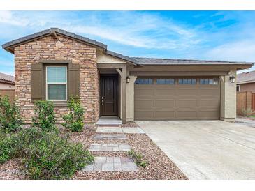 Charming single-story home with a stone facade and a well-maintained front yard at 4135 E Sagebrush St, Gilbert, AZ 85296