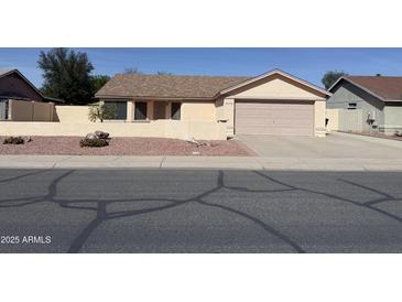 Charming single-story home with a well-maintained yard and a spacious two-car garage at 4678 W Whitten St, Chandler, AZ 85226