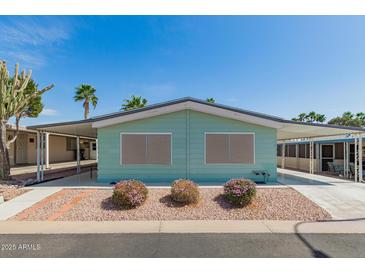 Charming single-story home with covered parking and desert landscaping in a vibrant community at 5402 E Mckellips Rd # 326, Mesa, AZ 85215