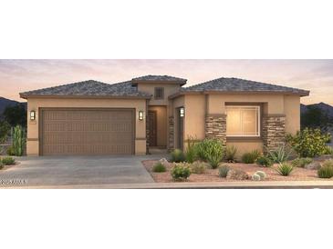 Attractive single-story home with desert landscaping and a two-car garage at 16722 W Saguaro Park Ln, Surprise, AZ 85387