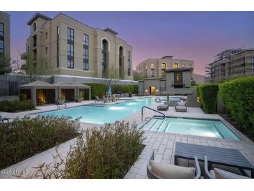 Beautiful swimming pool and spa surrounded by manicured landscaping and inviting lounge areas at 18720 N 101St St # 3021, Scottsdale, AZ 85255