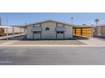 Charming single-story home with carport and well-kept gravel yard at 3330 E Main St # 7, Mesa, AZ 85213