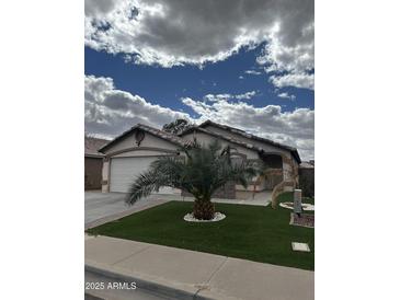 Charming single-story home boasting a lush green lawn and a well-maintained front exterior at 4546 N 84Th Ln, Phoenix, AZ 85037