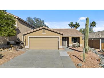 Charming single-story home featuring a two-car garage and low-maintenance desert landscaping at 15853 S 17Th Dr, Phoenix, AZ 85045