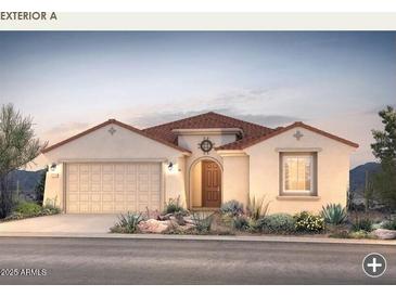 Charming single-story home featuring a two-car garage and beautifully landscaped front yard at 17627 W Palo Verde Dr, Litchfield Park, AZ 85340