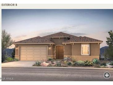 Charming one-story home showcasing a terracotta tile roof, desert landscaping, and a two-car garage at 17637 W Rancho Dr, Litchfield Park, AZ 85340