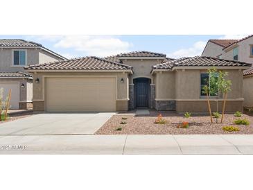 Charming single-story home with desert landscaping, tile roof, and a spacious two-car garage at 17637 W Rancho Dr, Litchfield Park, AZ 85340