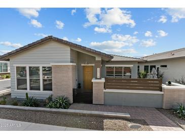 Charming single-story home featuring a well-manicured front yard and inviting curb appeal at 20718 W Colter St, Buckeye, AZ 85396