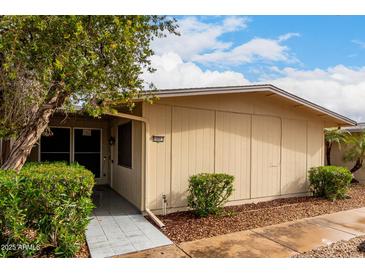 Cozy single-story home with charming desert landscaping and a well-maintained facade on a sunny day at 13311 W Copperstone Dr, Sun City West, AZ 85375