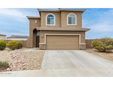 Charming two-story home with a two-car garage and desert landscaping at 284 N 199Th Dr, Buckeye, AZ 85326