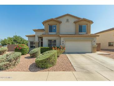 Charming two-story home featuring desert landscaping and a two-car garage at 17751 W Bloomfield Rd, Surprise, AZ 85388