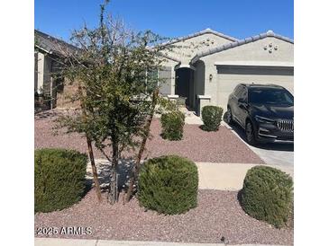 Charming single-story home featuring desert landscaping and a two-car garage at 18642 W Yucatan Dr, Surprise, AZ 85388