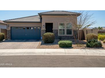 Charming single-story home with a blue garage door, neutral color scheme, and well-maintained landscaping at 2849 W Apollo Rd, Phoenix, AZ 85041