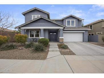 Charming two-story home featuring a well-manicured front yard and a two car garage at 2923 E Preston St, Mesa, AZ 85213