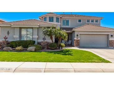 Charming two-story home with a well-manicured lawn and desert landscaping with lovely curb appeal at 3851 E Vallejo Dr, Gilbert, AZ 85298