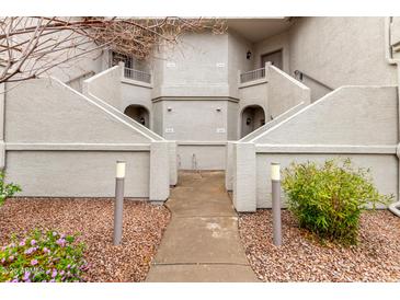 Condo exterior showcasing the front entrance and the unique architectural details at 9455 E Raintree Dr # 1049, Scottsdale, AZ 85260