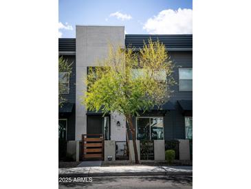 Charming modern home with a well-manicured front yard and inviting entrance, showcasing contemporary architecture at 7531 E Billings St # 132, Mesa, AZ 85207