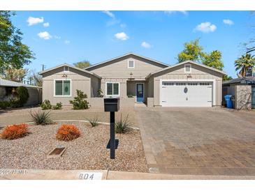 Charming single-story home featuring a two-car garage and a beautifully landscaped front yard at 804 E Palmaire Ave, Phoenix, AZ 85020