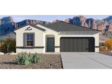 Charming single-story home with a neutral color scheme, two-car garage, and desert landscaping at 10616 W Sonrisas St, Tolleson, AZ 85353