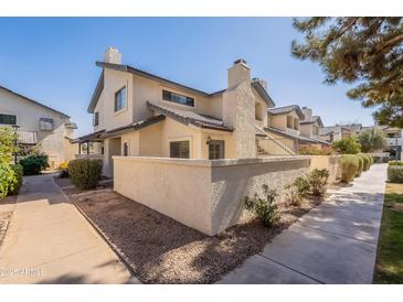 Inviting two-story townhouse featuring a private patio and manicured landscaping at 1222 W Baseline Rd # 116, Tempe, AZ 85283