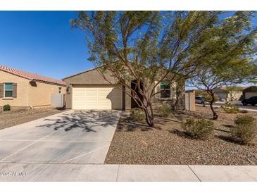 Charming single story home features a desert landscape, neutral tones, and a two car garage at 12324 W Northview Ave, Glendale, AZ 85307