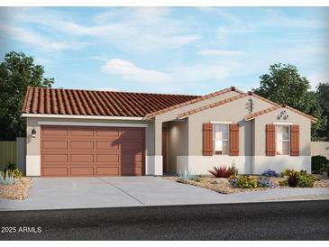 A single-story house featuring a two-car garage, desert landscaping, and a red tile roof at 17681 W Amber Dr, Goodyear, AZ 85338