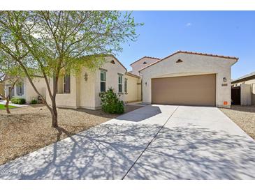 Beautiful single-story home with a two car garage and low maintenance desert landscaping at 1800 N 156Th Dr, Goodyear, AZ 85395