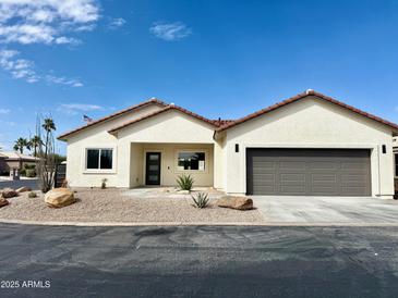 Charming single story home with desert landscaping and a two-car garage at 2101 S Meridian Rd # 42, Apache Junction, AZ 85120