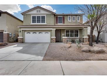 Beautiful two-story home featuring a two-car garage and low-maintenance desert landscaping at 29437 W Columbus Ave, Buckeye, AZ 85396